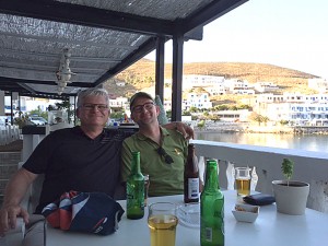 Jack and Neil enjoy a well-deserved beer, harborside in Astypalia